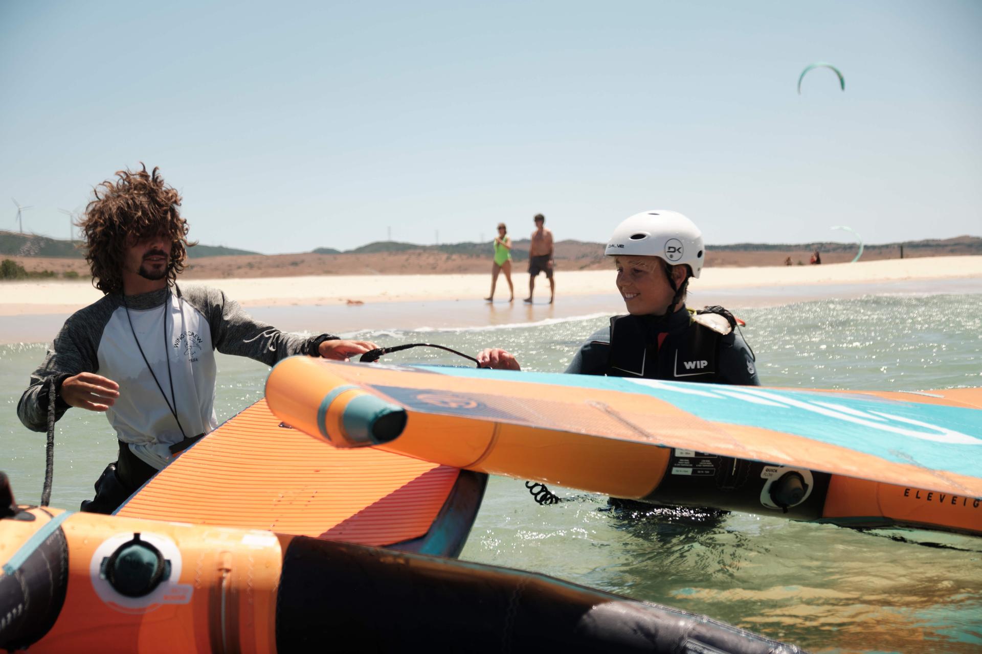 A student and an instructor in the water during a private lesson.